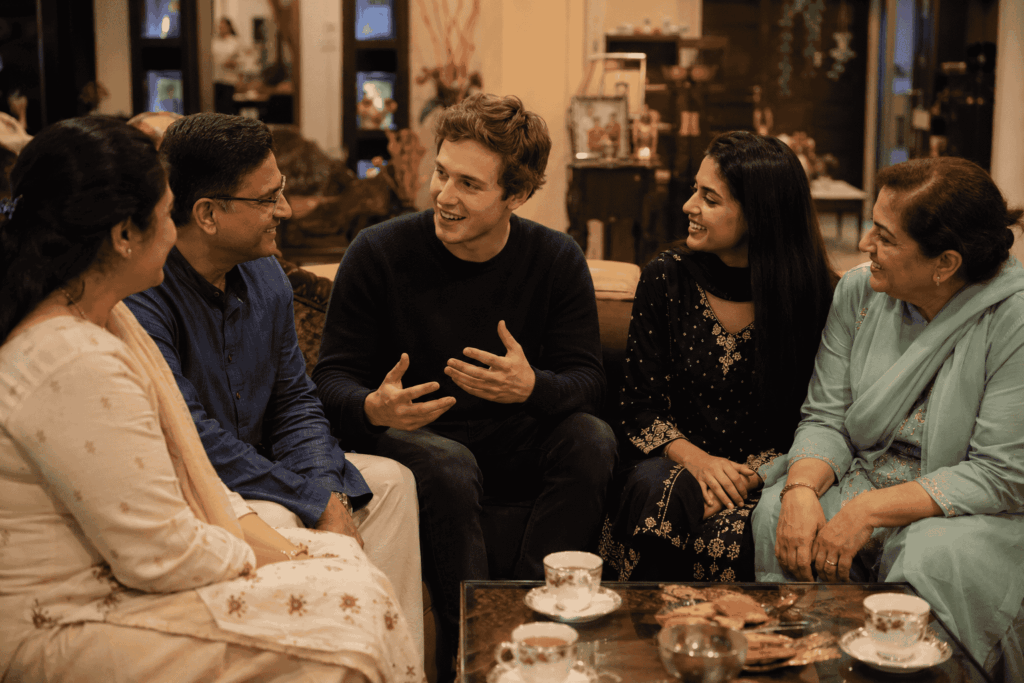 South Asian families celebrating Diwali with lights, sweets, and traditional clothing