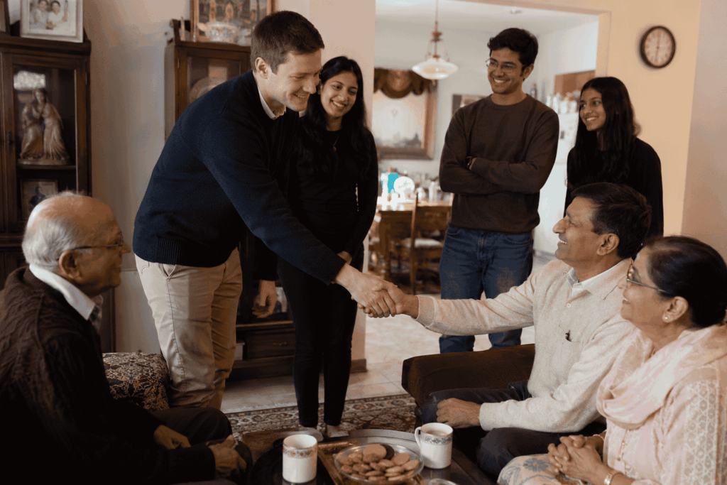 Intercultural couple learning South Asian traditions and family customs
